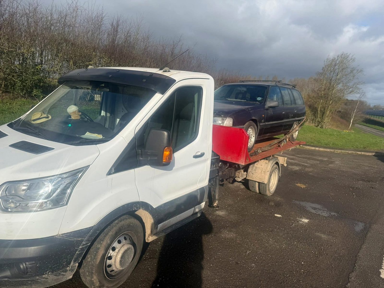 Recovery truck collecting an unwanted estate car